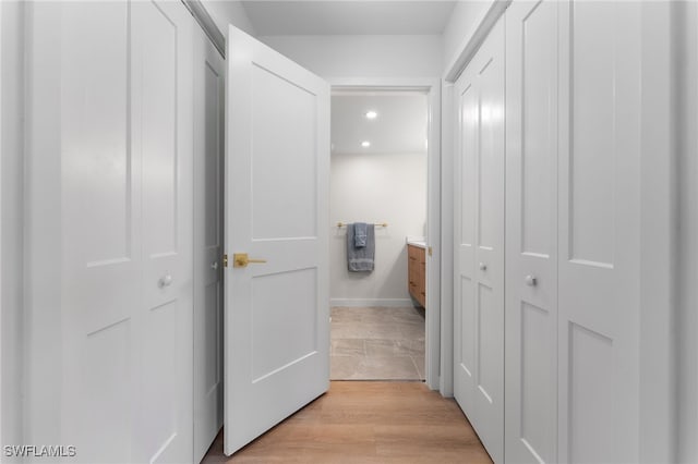 corridor featuring light hardwood / wood-style floors