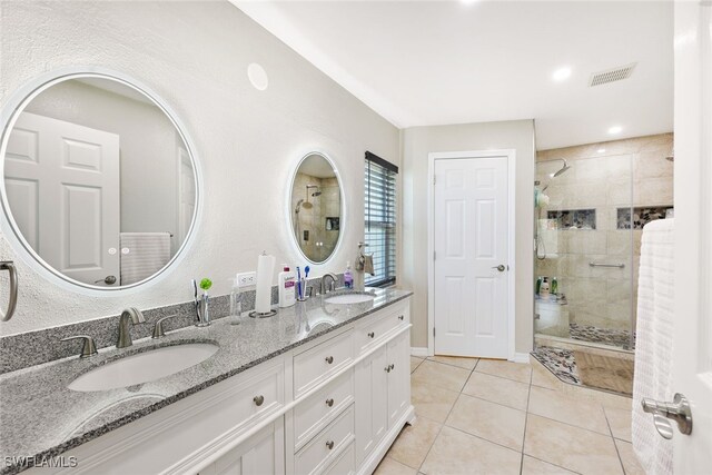 bathroom with vanity, tile patterned floors, and an enclosed shower