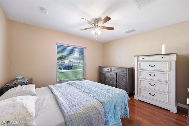 bedroom featuring ceiling fan and dark wood-type flooring