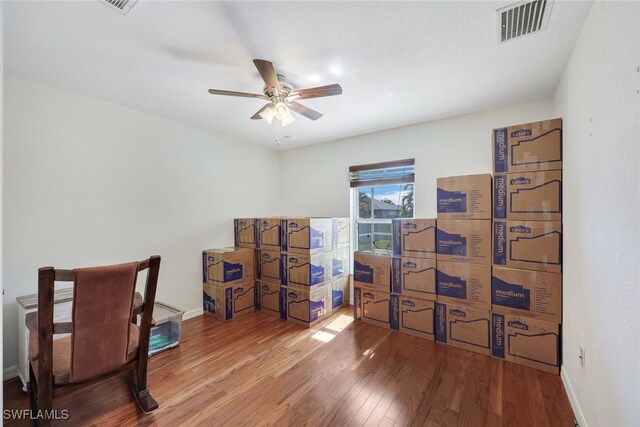 home office featuring ceiling fan and wood-type flooring