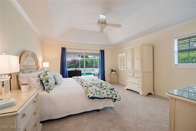 tiled bedroom with ceiling fan, crown molding, a tray ceiling, and access to outside