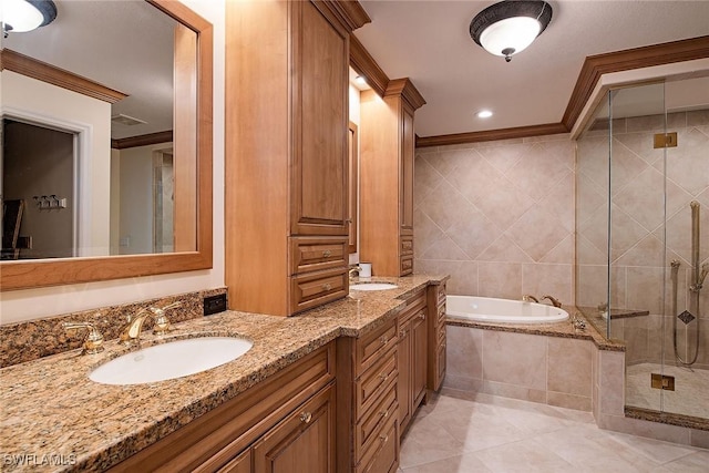 bathroom featuring tile walls, tile patterned flooring, ornamental molding, vanity, and separate shower and tub