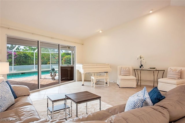 tiled living room featuring vaulted ceiling