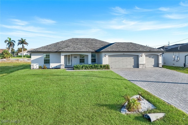 ranch-style house featuring a front lawn, decorative driveway, an attached garage, and stucco siding