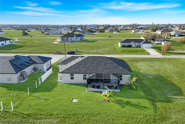 birds eye view of property with a residential view