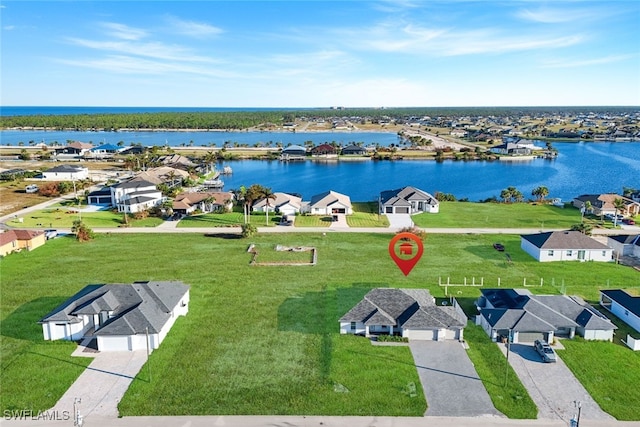 bird's eye view featuring a water view and a residential view