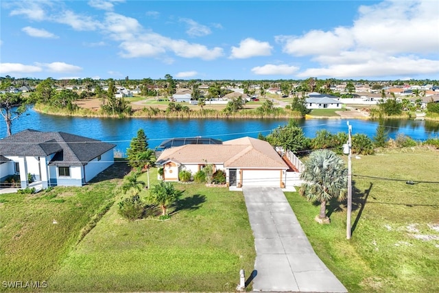 drone / aerial view with a residential view and a water view