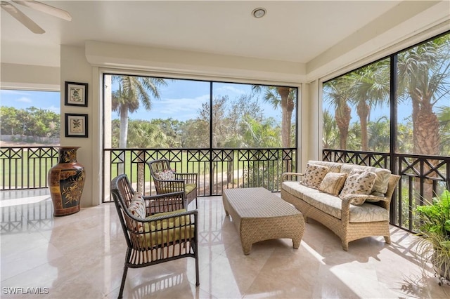 sunroom with a ceiling fan