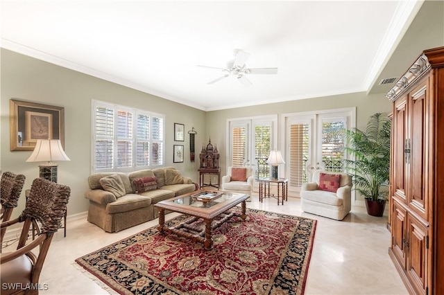 living room with a ceiling fan, crown molding, visible vents, and a wealth of natural light