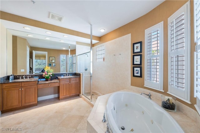 bathroom featuring double vanity, visible vents, a stall shower, a sink, and a tub with jets