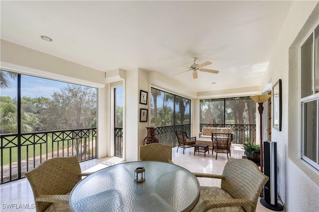 sunroom with a ceiling fan