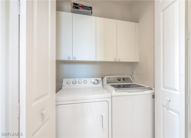 laundry room featuring cabinet space and independent washer and dryer