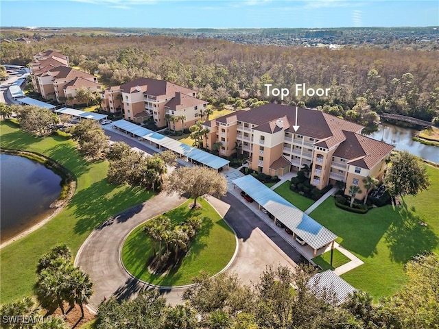 birds eye view of property with a water view