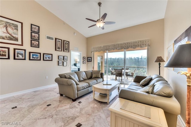 living room with ceiling fan and vaulted ceiling