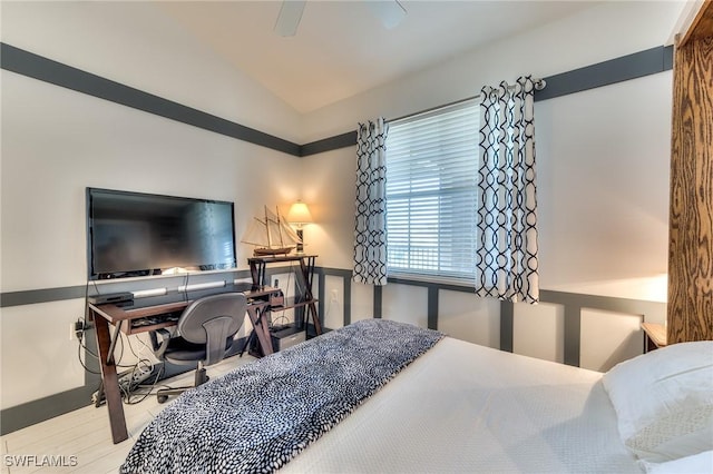 bedroom with ceiling fan and lofted ceiling