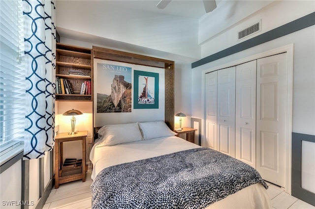 bedroom featuring ceiling fan and a closet