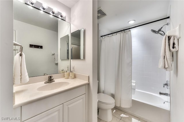 full bathroom featuring tile patterned floors, shower / tub combo with curtain, vanity, and toilet