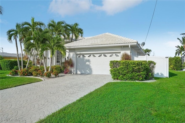 view of front of home featuring a garage and a front yard