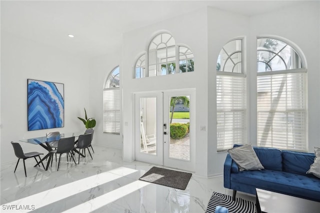 entryway featuring french doors and a wealth of natural light