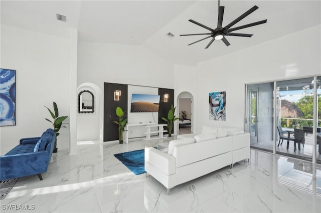 living room with ceiling fan and lofted ceiling