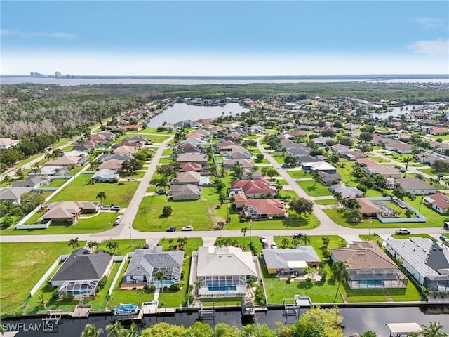 drone / aerial view with a water view