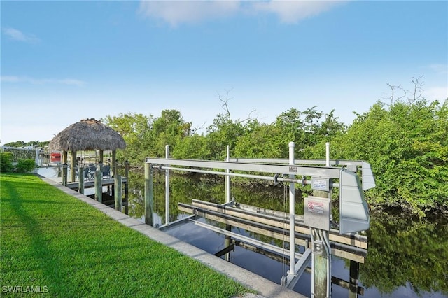 dock area featuring a yard and a water view