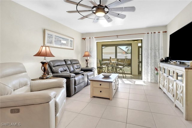 living room featuring ceiling fan and light tile patterned flooring