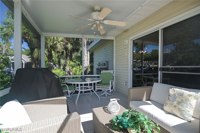 sunroom featuring ceiling fan