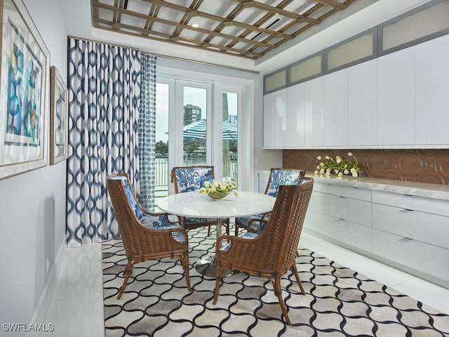 dining space featuring light tile patterned floors