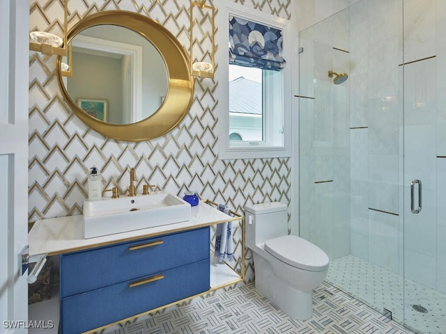 bathroom with vanity, tile patterned flooring, a shower with shower door, and toilet