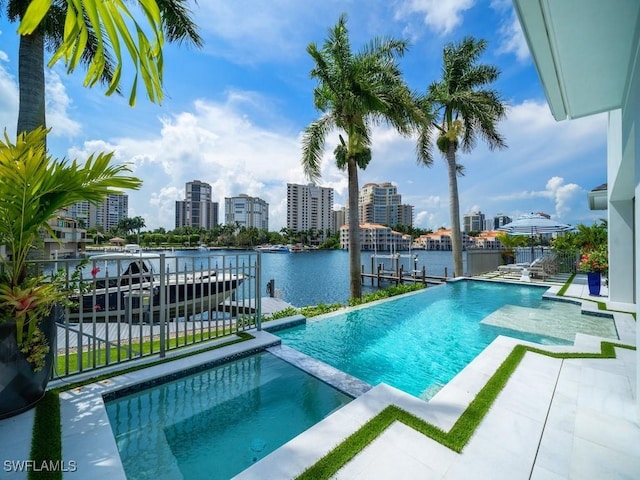 view of pool featuring a water view and a boat dock