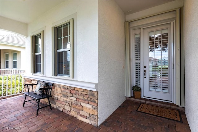 doorway to property with covered porch