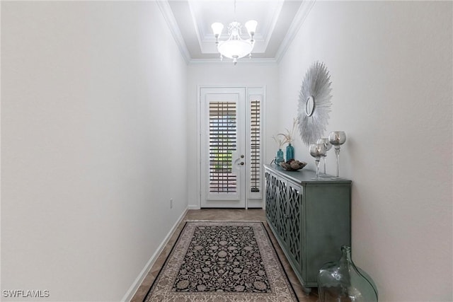 doorway to outside with crown molding and an inviting chandelier