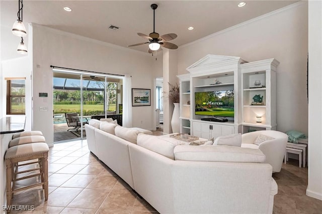 living room with ceiling fan, light tile patterned flooring, and ornamental molding