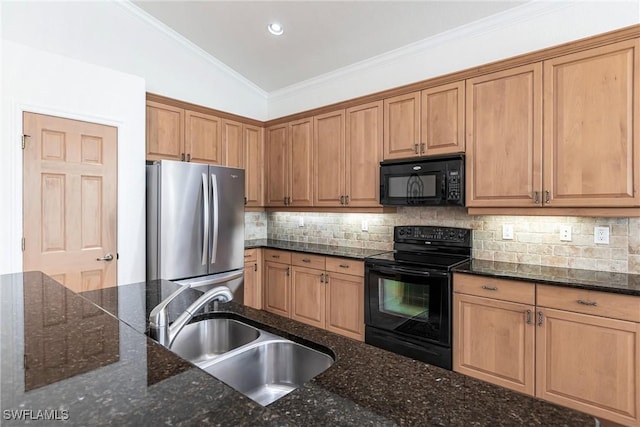 kitchen featuring dark stone counters, sink, and black appliances