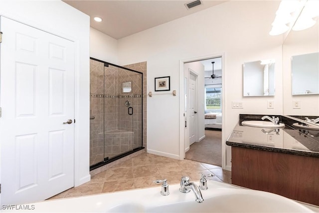 bathroom with ceiling fan, tile patterned flooring, vanity, and a shower with door