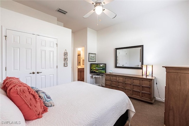 carpeted bedroom with ceiling fan, connected bathroom, and a closet