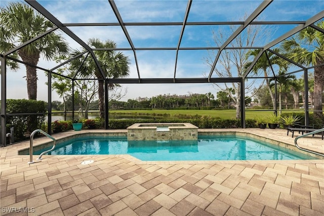 view of pool featuring an in ground hot tub, a patio, and a lanai