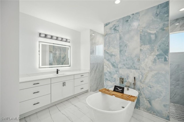 bathroom featuring vanity, tile walls, and plus walk in shower