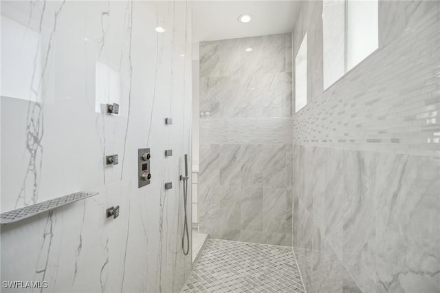 bathroom with a tile shower