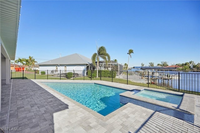 view of pool featuring a patio area, an in ground hot tub, and a water view