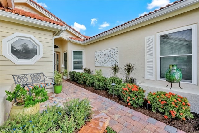 property entrance featuring a patio