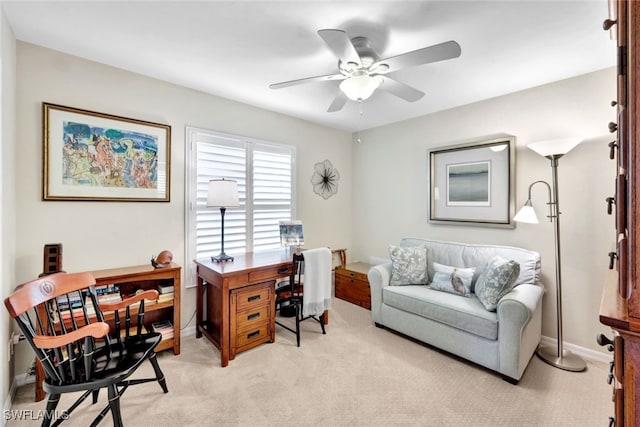 carpeted office space with ceiling fan