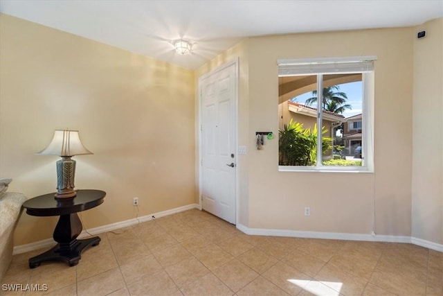 foyer entrance featuring light tile patterned floors