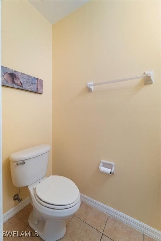 bathroom with tile patterned floors and toilet