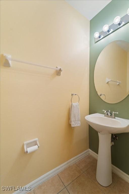 bathroom featuring sink and tile patterned flooring