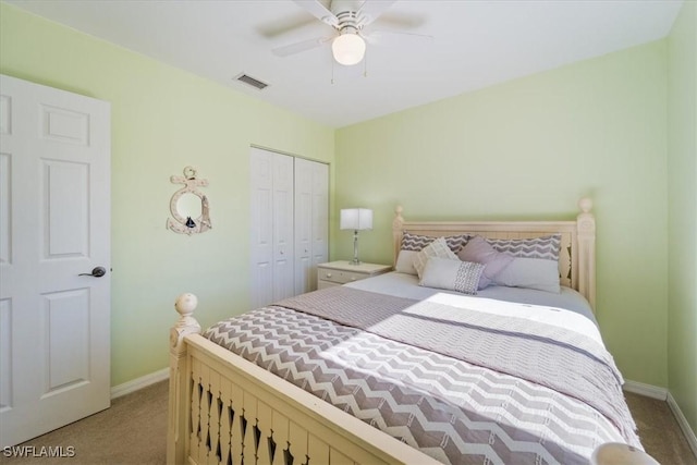 bedroom with ceiling fan, a closet, and carpet floors