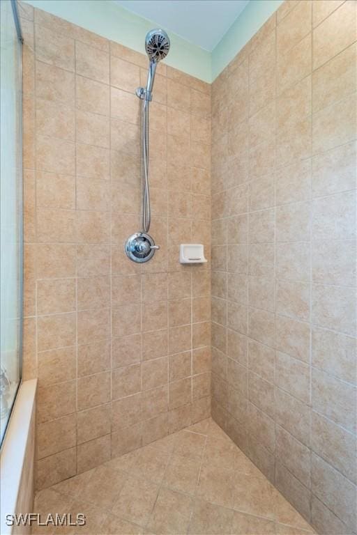 bathroom with tiled shower