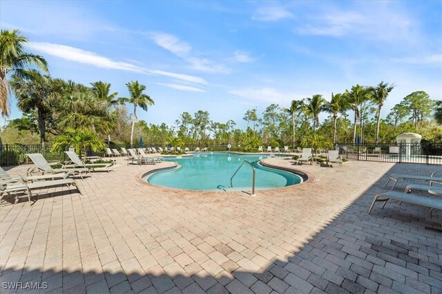 view of swimming pool with a patio area