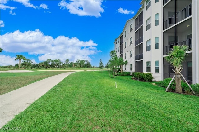 view of home's community with a lawn